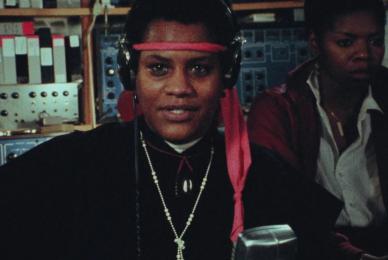 woman wearing headphones and black tee shirt